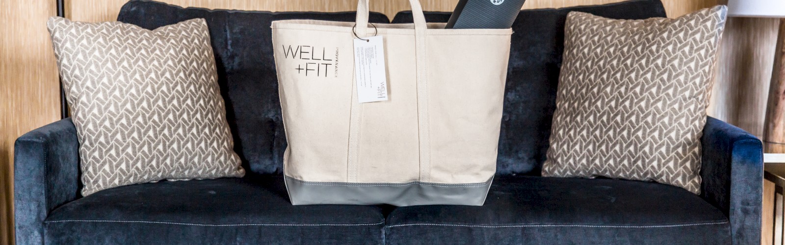 A beige tote bag labeled 