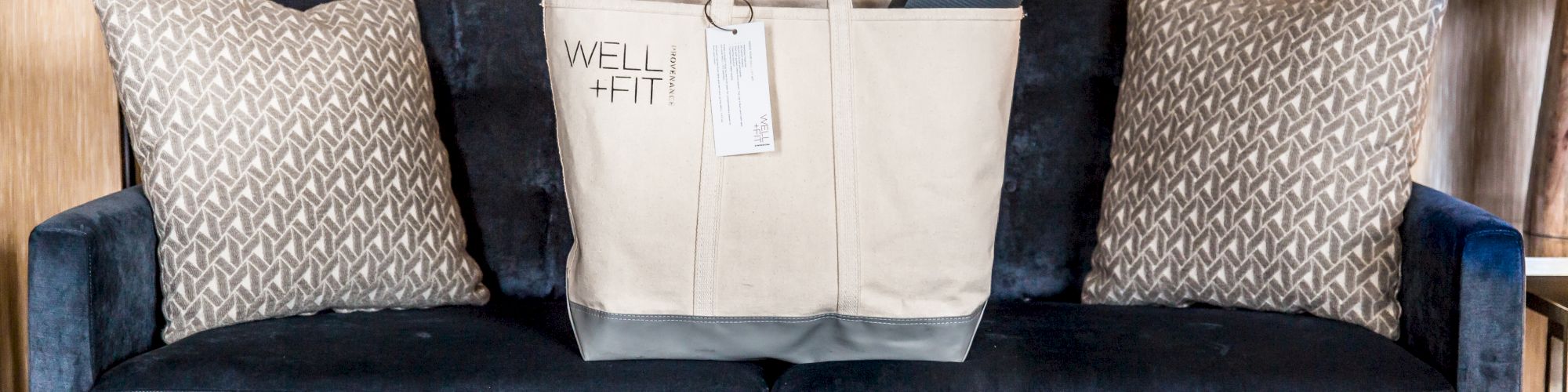 A beige tote bag labeled 